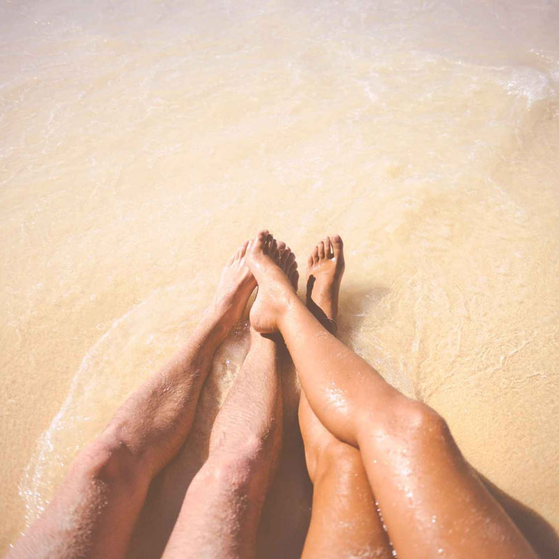 peoples legs on beach